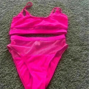 Two-piece high waist pink bathing suit.
